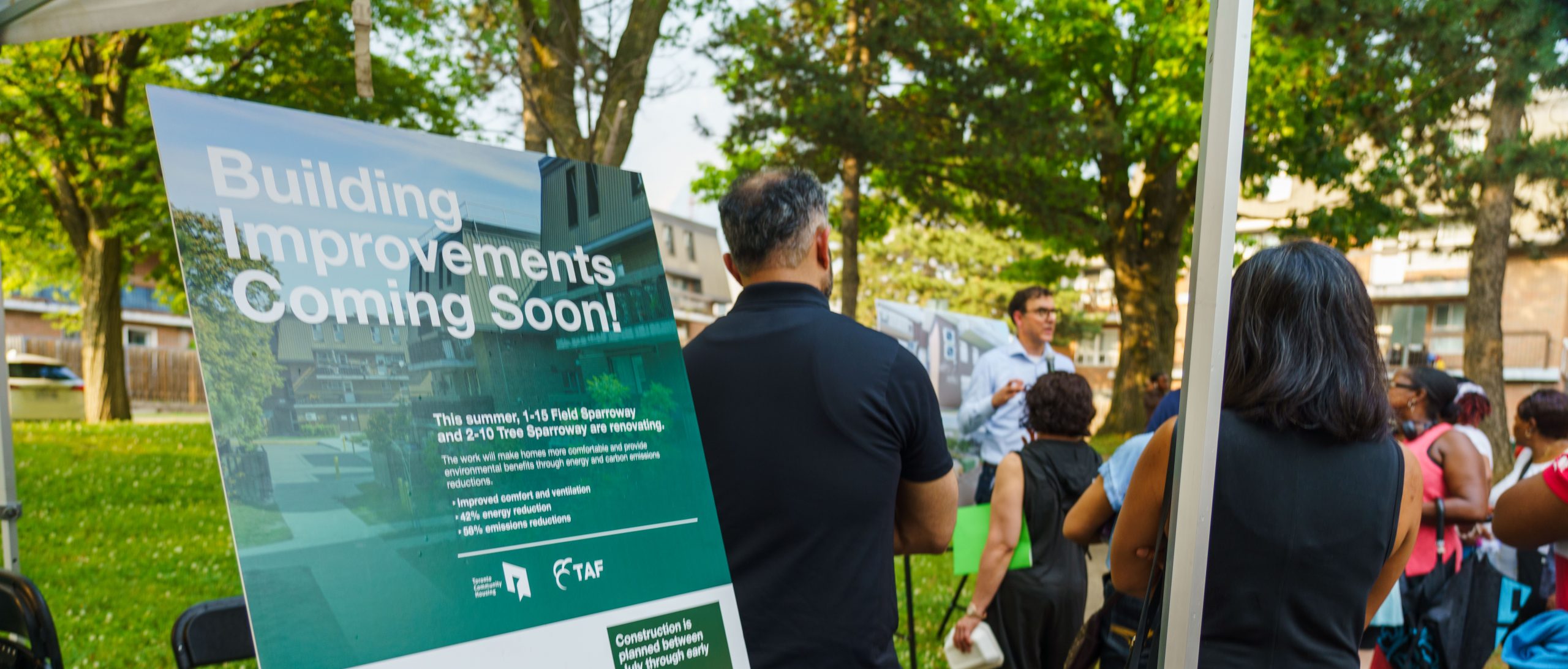 Sparroway community event shows people interacting with design plans